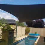 lap pool covered by a shade sail