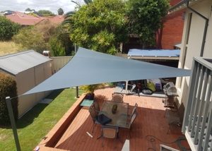 Shade sail over paved entertaining area